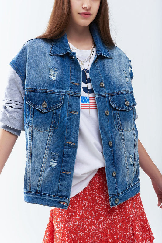Person wearing a distressed denim vest over a white shirt with an American flag design, paired with a red skirt, against a white background. This bold lesbian outfit is a perfect example of patriotic lesbian fashion and confident lesbian style.