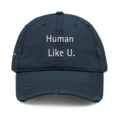 Close-up of a stylish cap with clear 'Human Like U.' text branding on a white background. This versatile headwear is an essential accessory for authentic lesbian style and confident lesbian fashion.