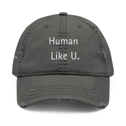 Close-up of a stylish gray cap with clear 'Human Like U.' text branding on a white background. This versatile headwear is an essential accessory for authentic lesbian style and confident lesbian fashion.