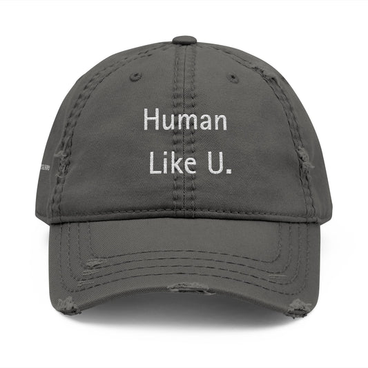 Close-up of a stylish gray cap with clear 'Human Like U.' text branding on a white background. This versatile headwear is an essential accessory for authentic lesbian style and confident lesbian fashion.