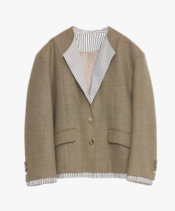 Close-up of a beige cardigan featuring a contrasting striped shirt collar on a white background. This layered look is a staple of comfortable lesbian clothing and defines a classic lesbian style.