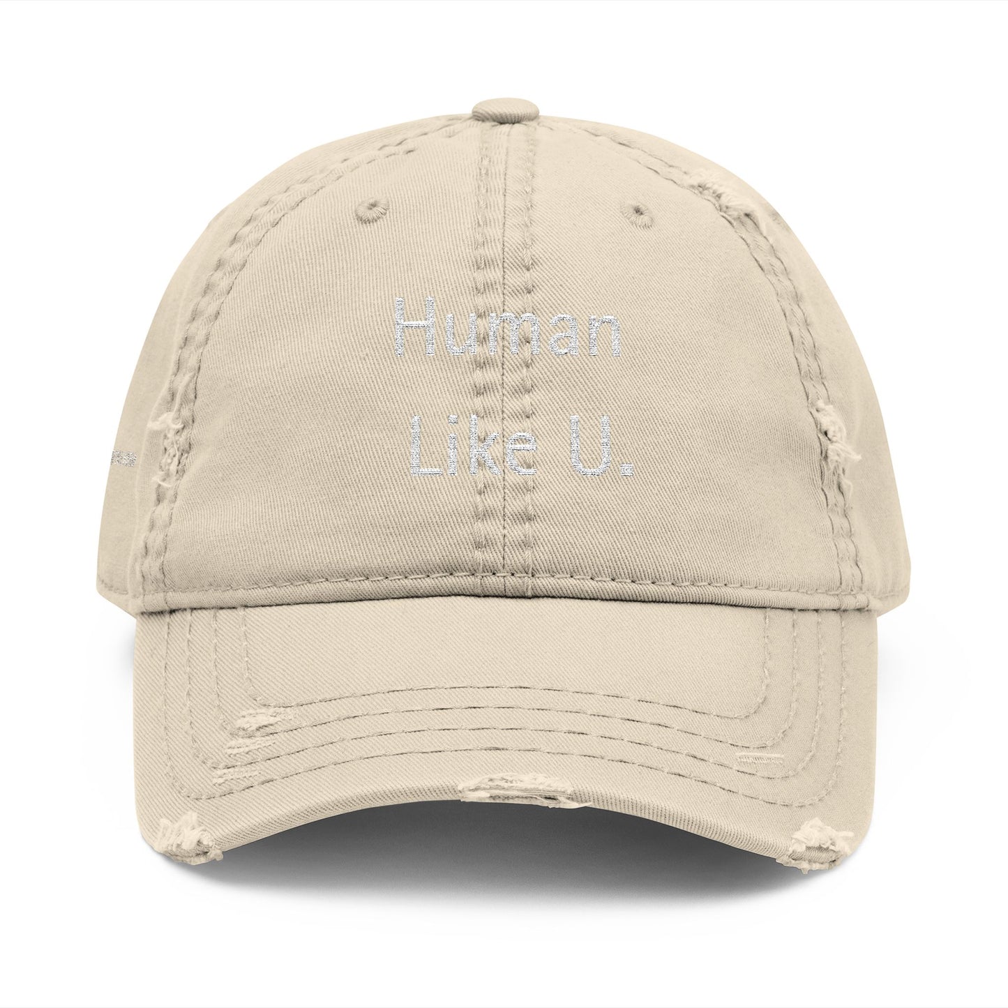 Close-up of a stylish cap with clear 'Human Like U.' text branding on a white background. This versatile headwear is an essential accessory for authentic lesbian style and confident lesbian fashion.