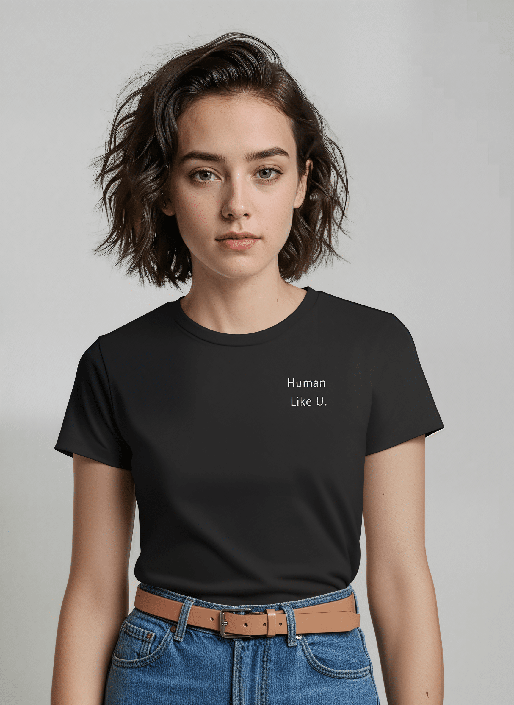 Person wearing a black t-shirt with bold 'Human Like U.' text and branding on a plain background. This comfortable lesbian outfit is a perfect example of casual lesbian clothing and authentic lesbian style.