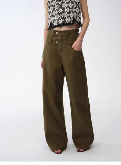 Person wearing olive green wide-leg pants on a white background. This casual lesbian outfit is a perfect example of confident lesbian fashion style and effortless lesbian style.