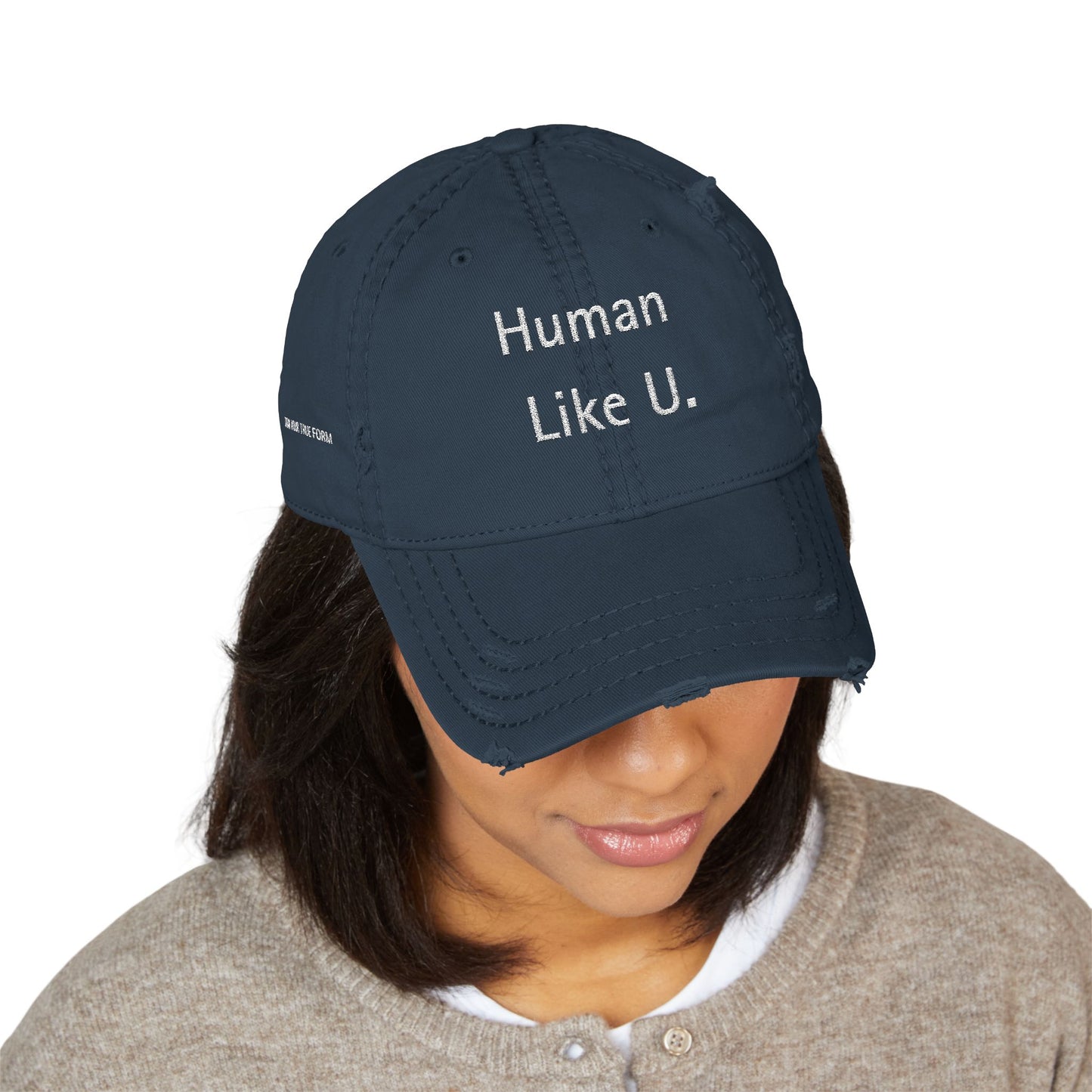 Person wearing a crisp navy blue cap with 'Human Like U.' text branding against a white background. This confident headwear is an essential accessory for defining authentic lesbian style and relaxed lesbian fashion.