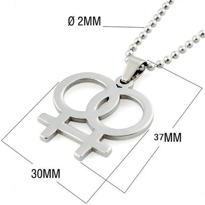 Silver necklace featuring a double gender symbol pendant on a dark surface. A key piece of lesbian fashion to define your lesbian style. Essential lesbian attire accessory for a confident lesbian outfit.