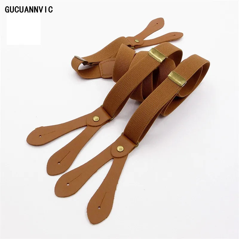 Close-up of classic brown suspenders with polished gold clips on a white background. These stylish accessories are essential for creating a sharp lesbian outfit and defining authentic lesbian style.