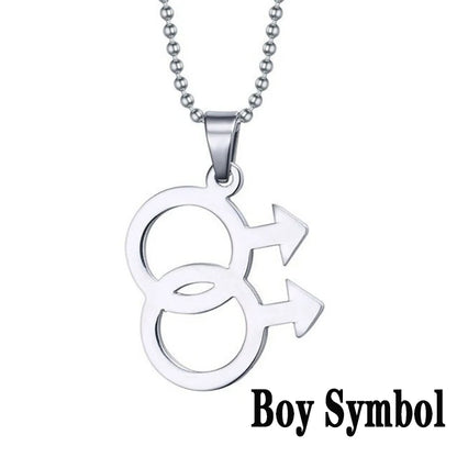 Silver necklace featuring a double gender symbol pendant on a dark surface. A key piece of lesbian fashion to define your lesbian style. Essential lesbian attire accessory for a confident lesbian outfit.