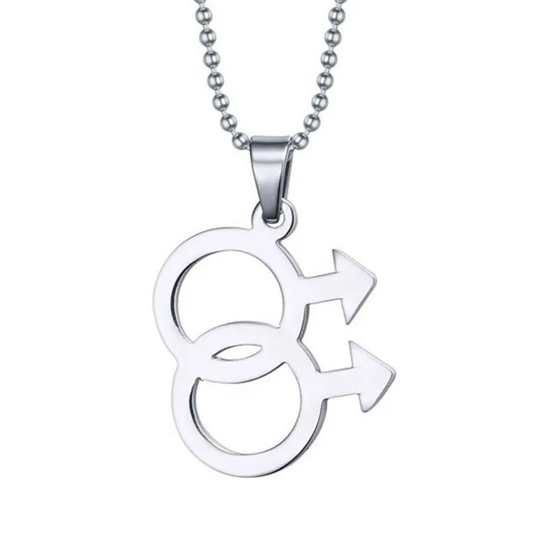 Silver necklace featuring a double gender symbol pendant on a dark surface. A key piece of lesbian fashion to define your lesbian style. Essential lesbian attire accessory for a confident lesbian outfit.