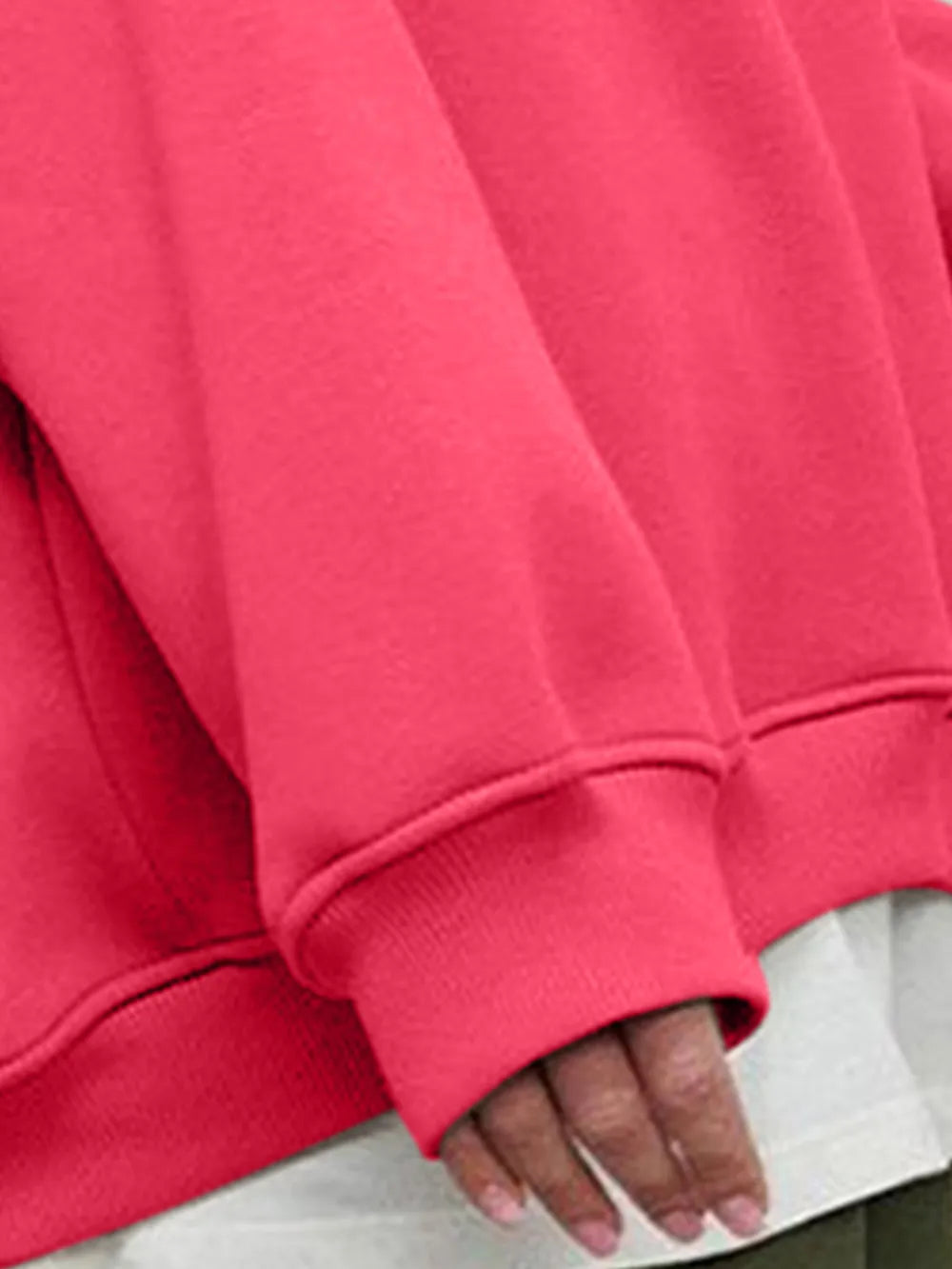 Person wearing a comfortable, bright pink oversized sweatshirt on a plain background. This bold lesbian outfit is a perfect example of casual lesbian clothing and vibrant lesbian style