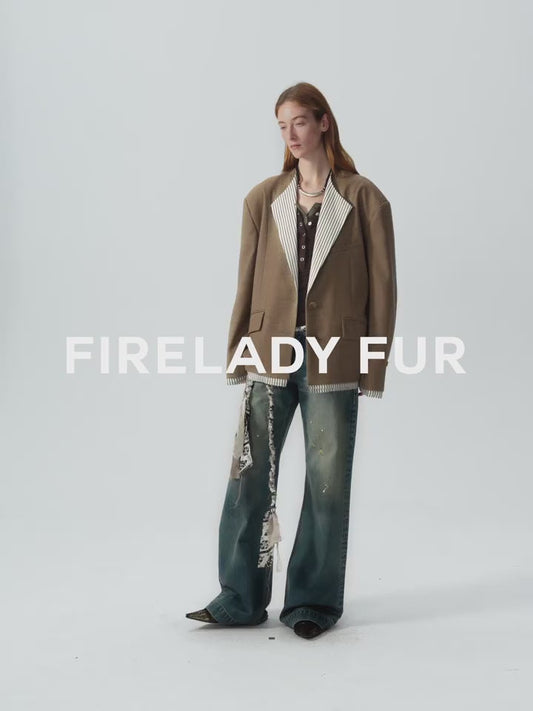 Person wearing a brown coat with 'Firelady Fur' branding on a white background. This statement piece of lesbian fashion defines a confident lesbian style and is essential lesbian clothing.