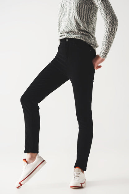 Person wearing sharp black pants and a cozy gray sweater against a white background. This classic lesbian outfit is a perfect example of confident lesbian fashion and authentic lesbian style.