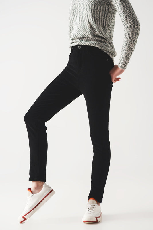 Person wearing sharp black pants and a cozy gray sweater against a white background. This classic lesbian outfit is a perfect example of confident lesbian fashion and authentic lesbian style.